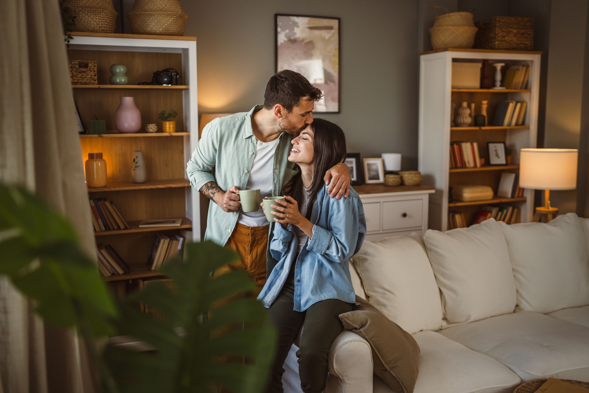 Boyfriend and girlfriend drink coffee and enjoy at home