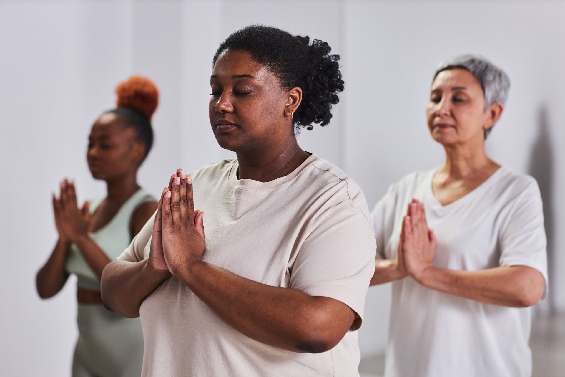 Group of people meditating in class